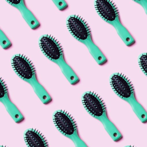 Green hair brush pattern on pink
