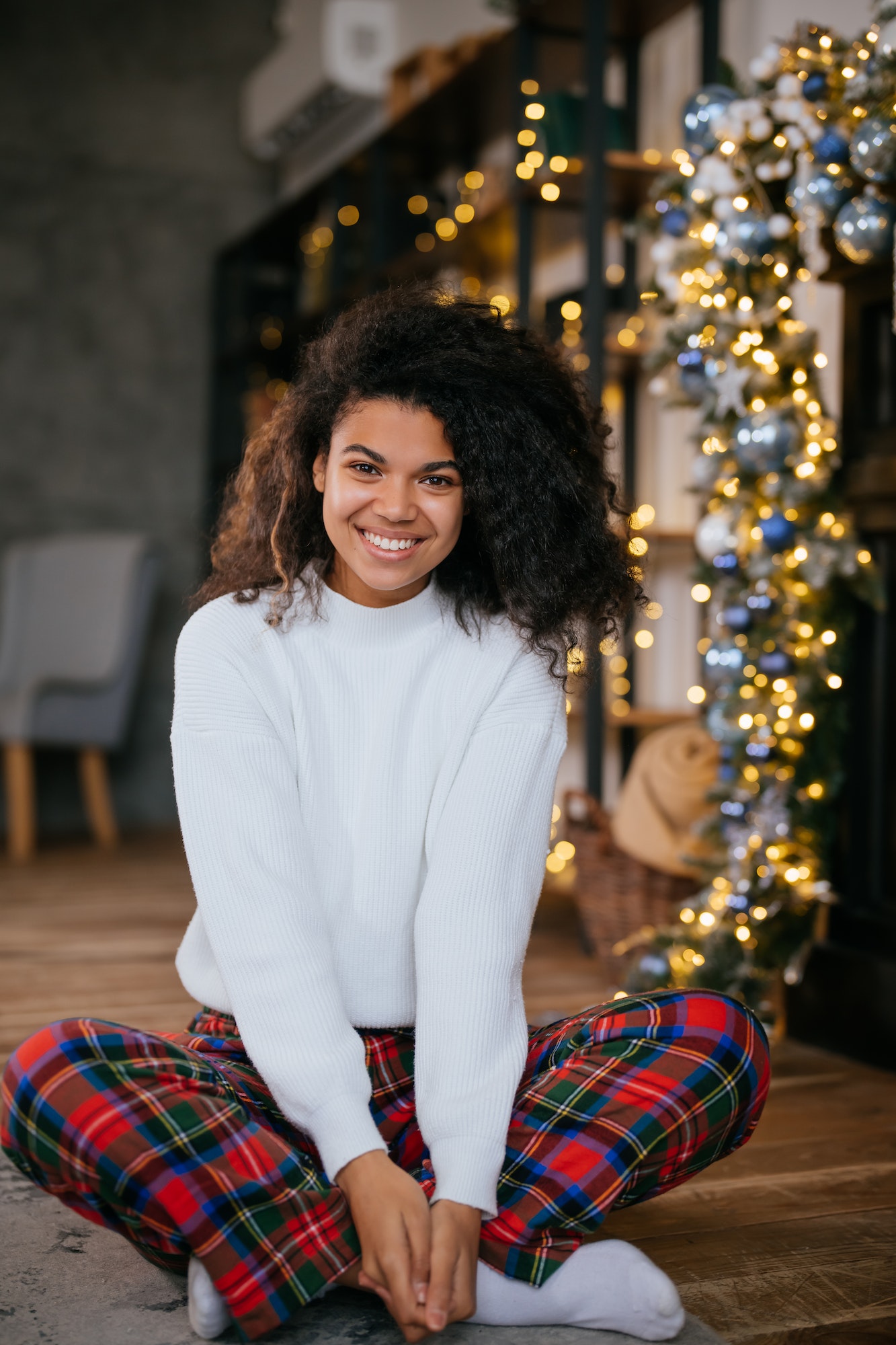 Beautiful young african american woman on the floor