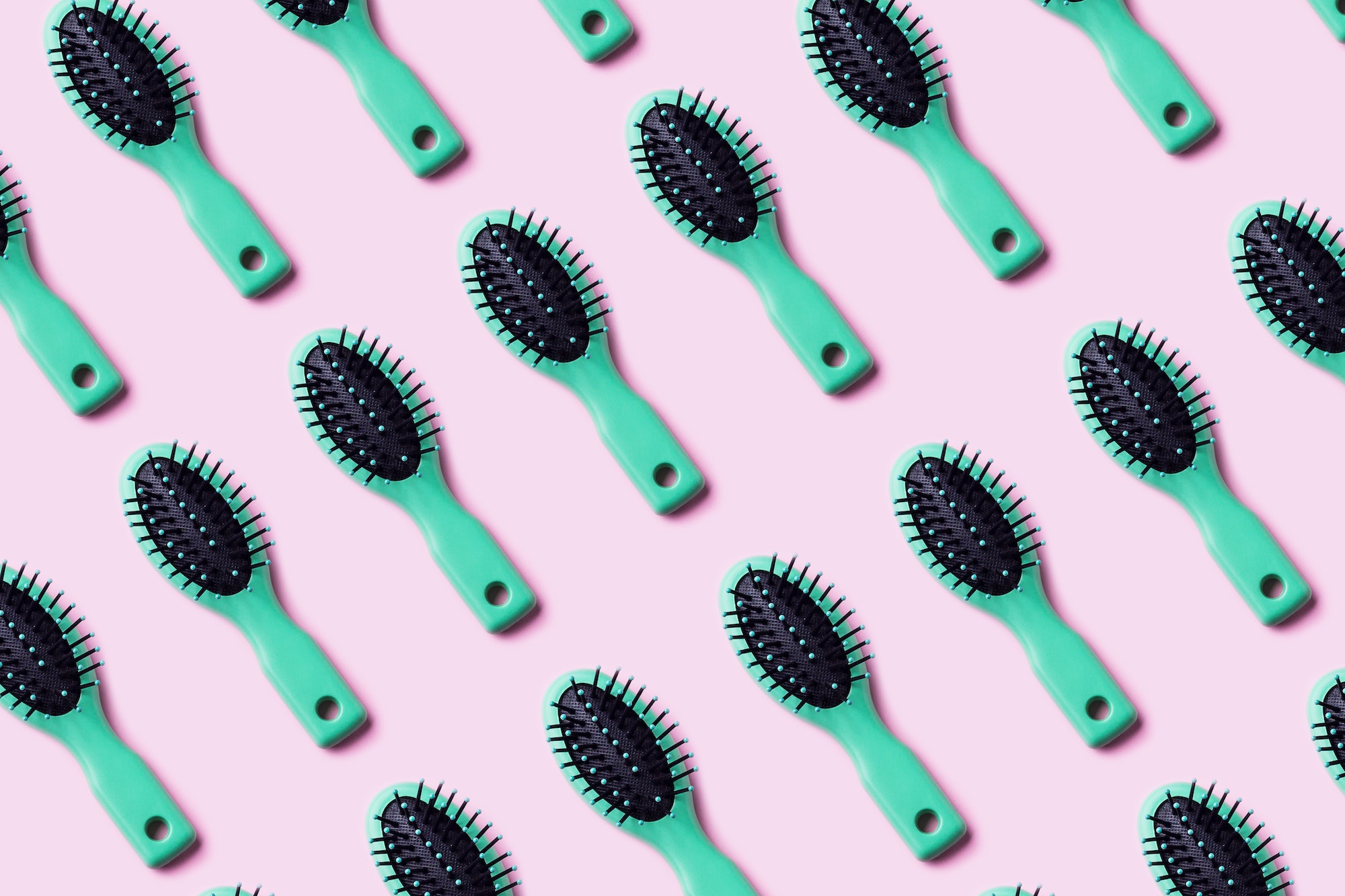 Green hair brush pattern on pink